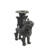 A small cast brass Foo dog or Pixiu holding a