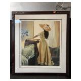 A framed artwork that appears to be a signed and