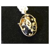 Sterling locket filled w/ gemstones
