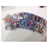 Mixed Sports cards in cases & sleeves with stars