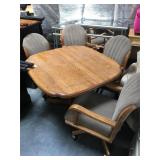 Wood dining table with 4 rolling chairs
