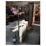 Rolling metal clothing rack