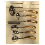 Carved horn handled serving cutlery