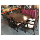 Antique claw foot dining table with 10 chairs and