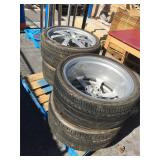 Set of 4 305/30 ZR22 105Y tires on rims