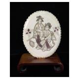 Signed Ivory scrimshaw pendant mounted on wood