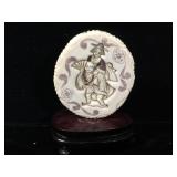 Signed Ivory scrimshaw pendant mounted on wood