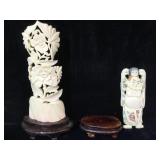Bone scrimshaw pendant mounted on wood stand,
