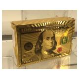 Golden $100 bill playing cards