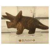 Carved stone brown aragonite triceratops