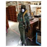 Female mannequin with military clothing and metal