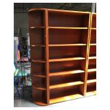 7 foot tall wood bookshelf with left side rounded