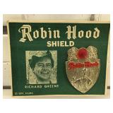 Robin Hood shield on original card, from Off