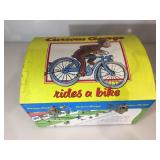 Curious George items inc play trunk, with a tin