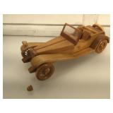 16 inch Wood model of an open roadster,signed  M.