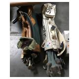 Pair of golf bags with clubs