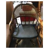Vintage rolling armchair with caning