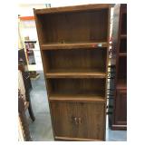 Pair of 6 foot tall shelves with lower storage