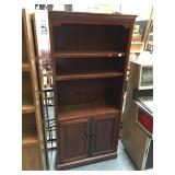 6 foot tall wooden bookshelf with lower storage