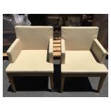 Pair of white arm chairs from high end hotel