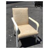 4 White arm chairs w/pattern print