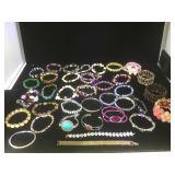 Batch of 37 costume jewelry bracelets.