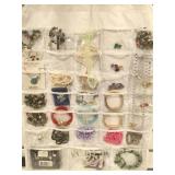 Hanging jewelry bag filled with a assortment of