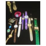 Assortment of 13 costume jewelry watches . Face