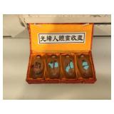 Set of 4 erotica snuff bottles in original box,