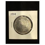 1884 Morgan Silver Dollar in flip