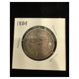 1884 Morgan Silver Dollar in flip