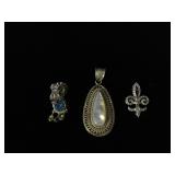 Pair of Sterling Silver pendants and Sterling