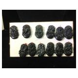 Lot of 12 carved dark green stone Zodiac pendants