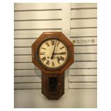Antique wall clock with key. It is missing the
