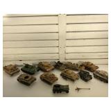Group of toy model WW2 tanks and other vehicles
