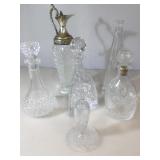5 crystal and pressed glass decanters , cut glass