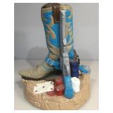 Ceramic western boot , pistol and poker chips