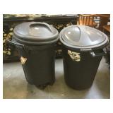 Pair of black plastic trash cans both are 32