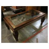 Wooden coffee table w/glass top, approx 26x50x18