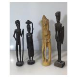 Wooden statues. Four assorted carved figures.