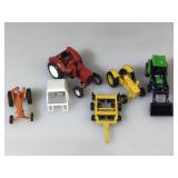 4 diecast tractors. Various makers. red has