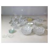 Assortment of glass candle stick holders and wax