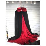 Black velvet hooded full length cape with red