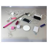 Lot of assorted phone chargers, cords and more.