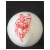 25 MM marble, white, displaying a flying Superman