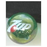 25 MM marble, iridescent, displaying 7UP