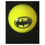 25 MM marble, yellow, displaying Batman