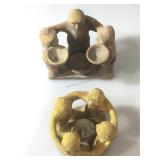 Two candle holders depicting Circle of Friends a