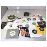 Box of 45s and a cassette player from Realistic.