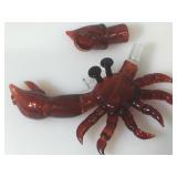 Hand-crafted red glass crab-shaped water pipe.